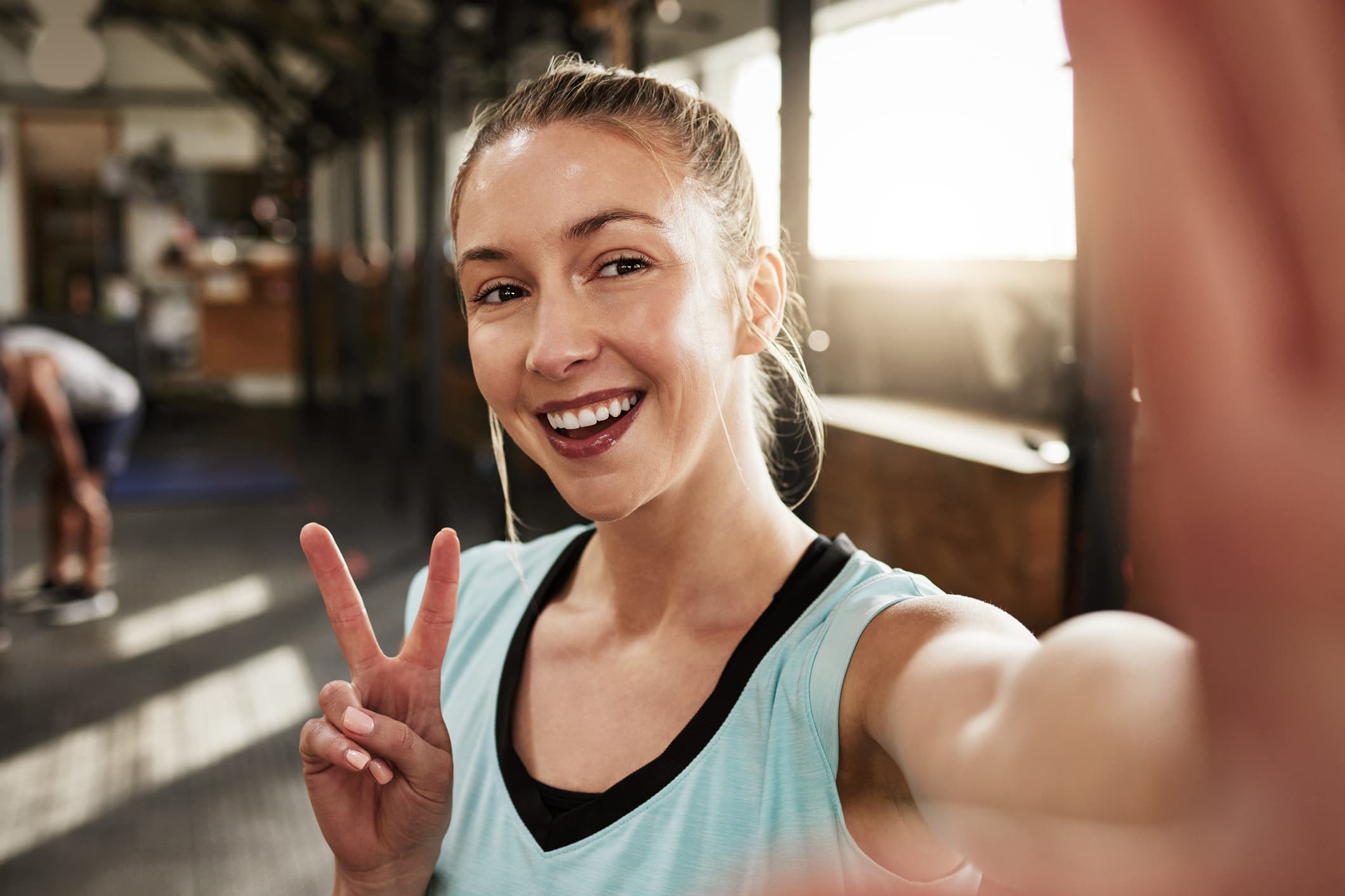 Woman taking a selfie in a fitness center