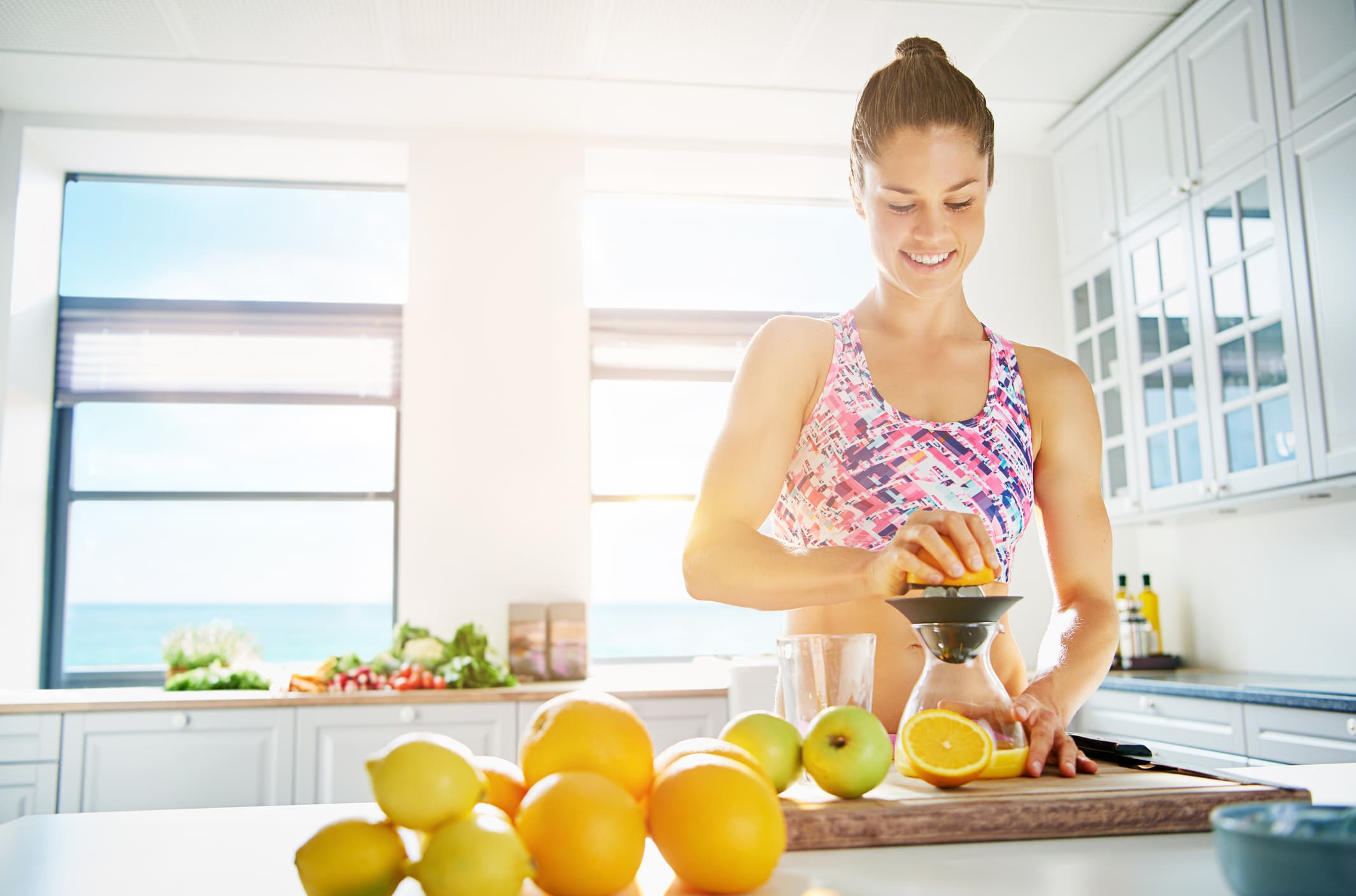 Woman making a blended fruit drink